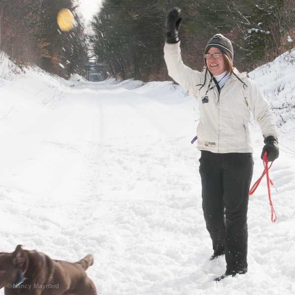 Liz throwing the ball for Ellie. 