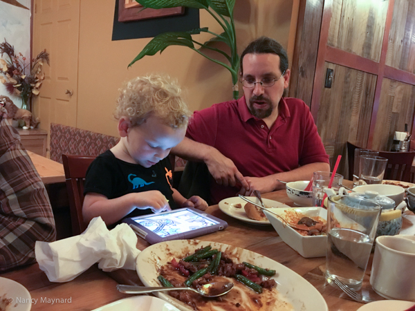 Ethan Frantz looks on as Karl amuses himself at the restaurant.